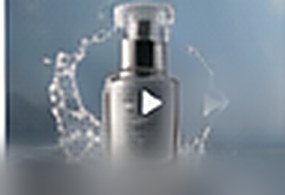 Silver bottle in a burst of water
