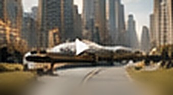 Empty road running into a dense city skyline